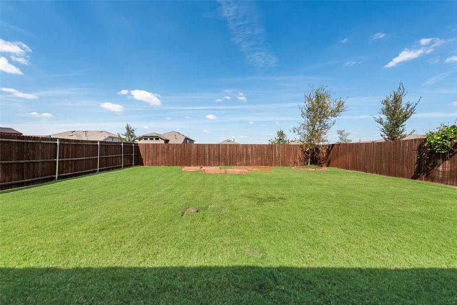 Ranch-style home featuring driveway, brick siding, a yard, an attached garage, and roof with shingles Ranch-style home featuring driveway, brick siding, a yard, an attached garage, and roof with shingles