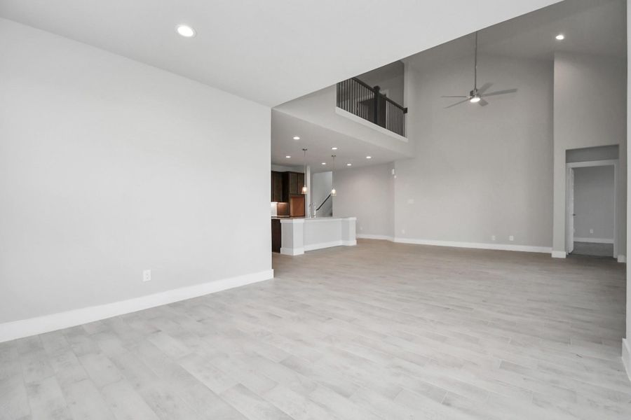 This seamless open concept ensures a connected flow between the family room, kitchen, and this dining area. Sample photo of completed home with similar floor plan. Actual colors and selections may vary. This seamless open concept ensures a connected flow between the family room, kitchen, and this dining area. Sample photo of completed home with similar floor plan. Actual colors and selections may vary.