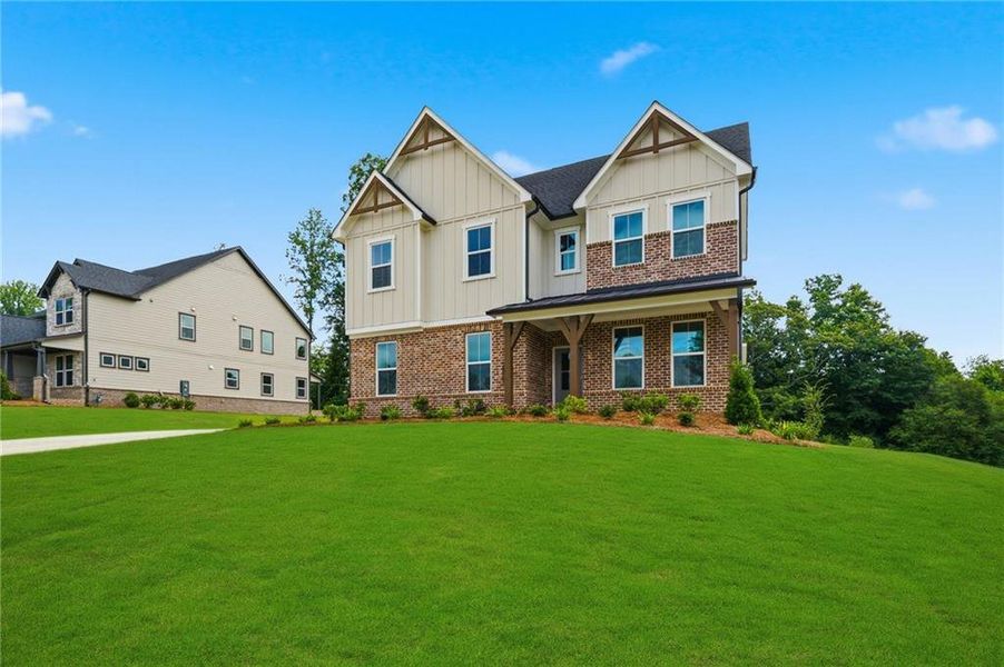 Front exterior of a new home in Acacia, Cumming, GA, highlighting curb appeal (Image 25). Front exterior of a new home in Acacia, Cumming, GA, highlighting curb appeal (Image 25).