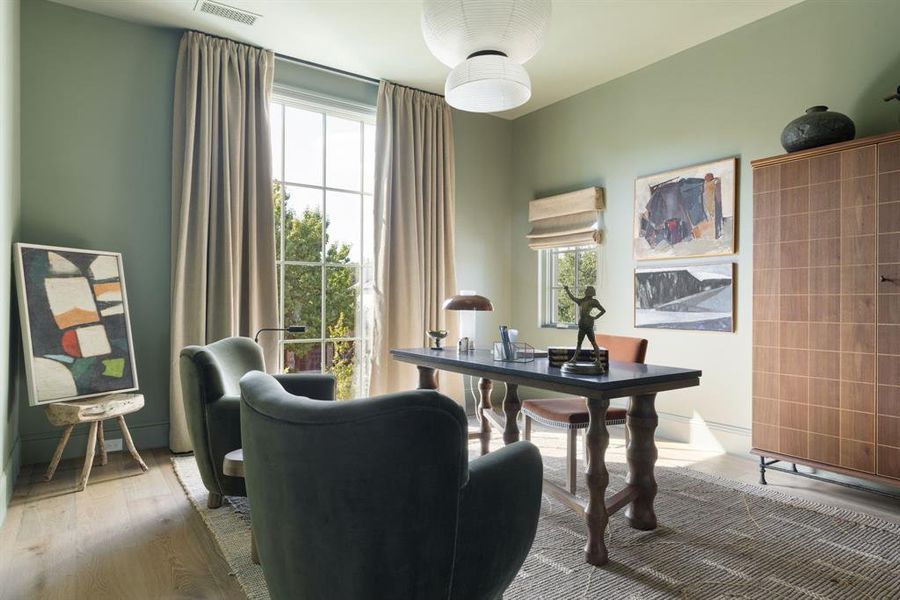 Home office with light wood finished floors