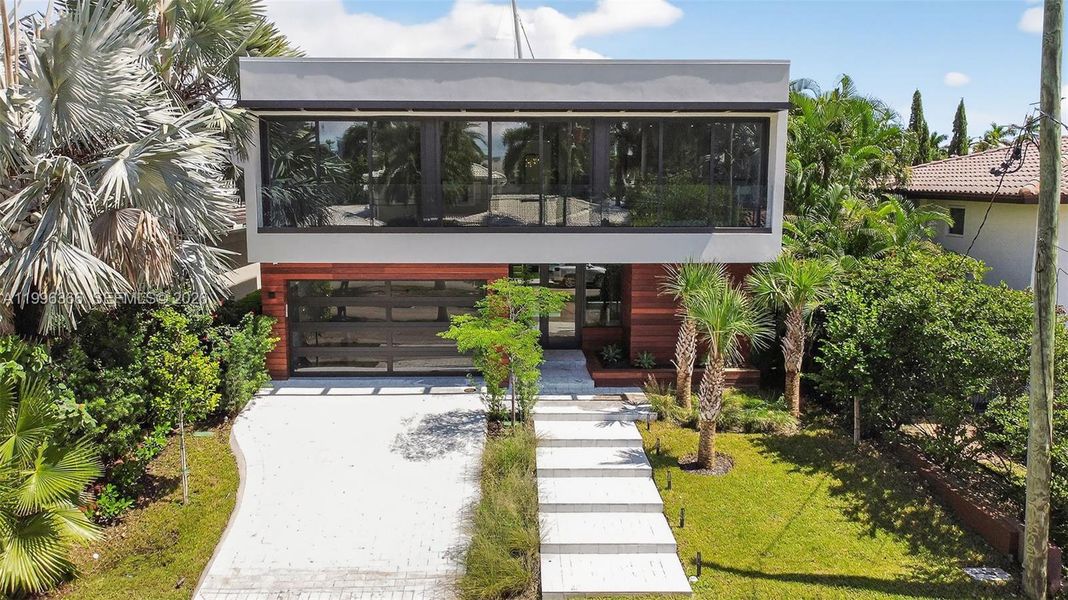 Front exterior of a new home in , Fort Lauderdale, FL, highlighting curb appeal (Image 1). Front exterior of a new home in , Fort Lauderdale, FL, highlighting curb appeal (Image 1).