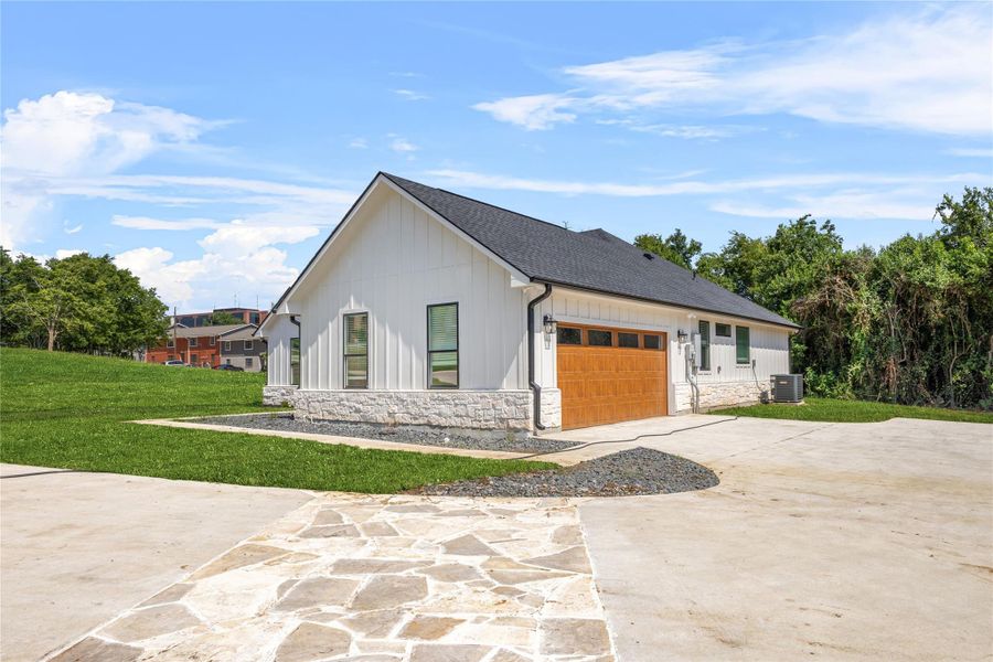 Front exterior of a new home in , Brenham, TX, highlighting curb appeal (Image 19).