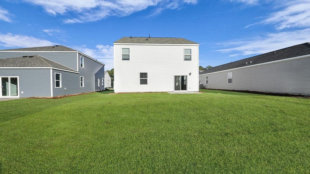 Exterior details and patio area of a home in Pine Hills at Cane Bay, Summerville (Image 3).