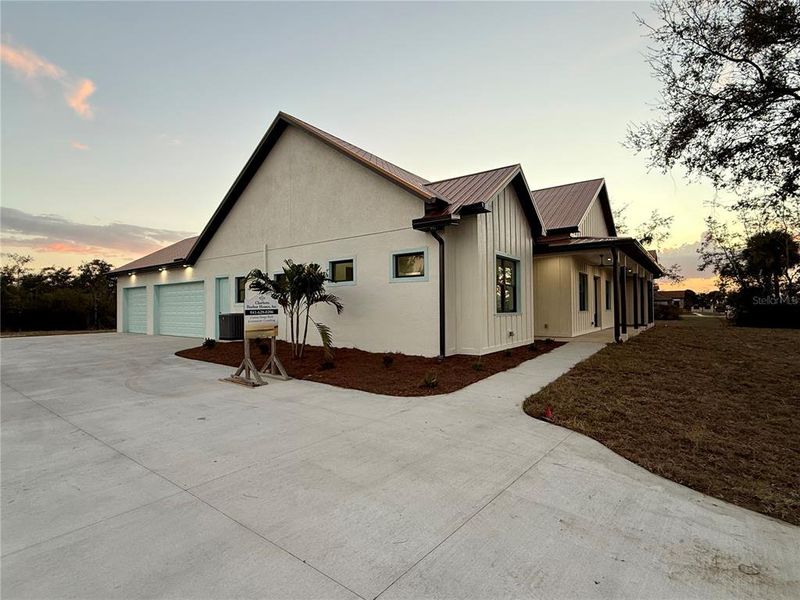 Front exterior of a new home in , Punta Gorda, FL, highlighting curb appeal (Image 23).