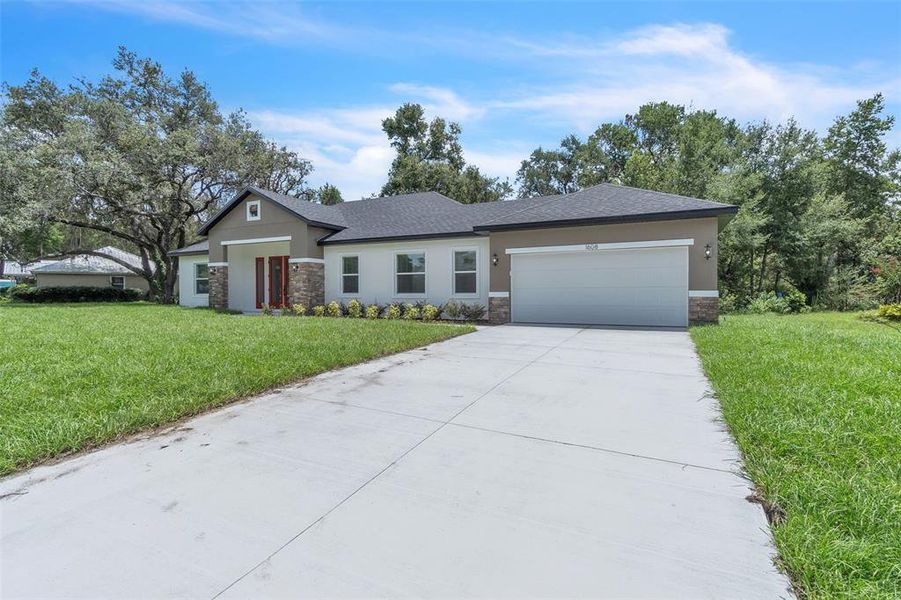 Front exterior of a new home in , Fruitland Park, FL, highlighting curb appeal (Image 18).