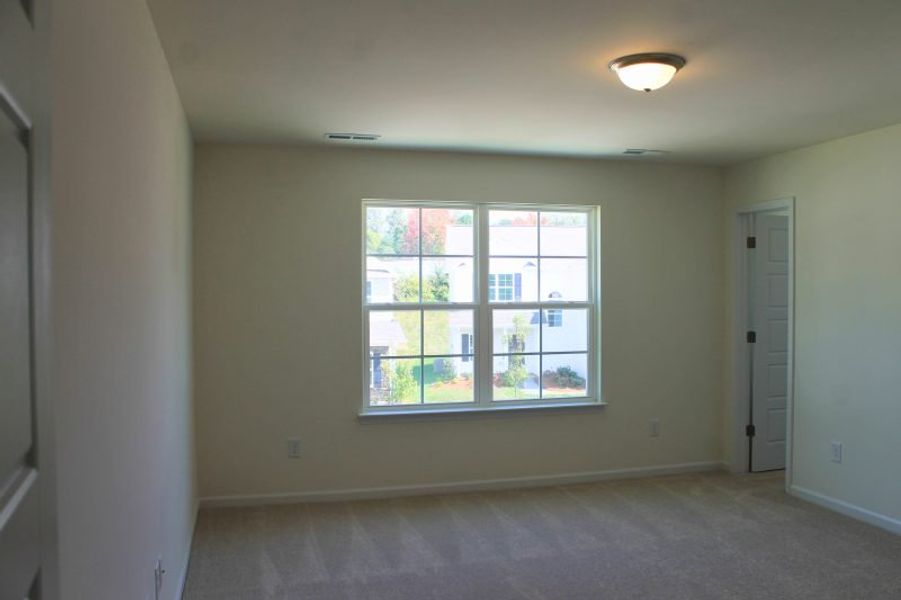 Spacious, unfurnished interior of a new home in The Wilcox, Greensboro (Image 21).