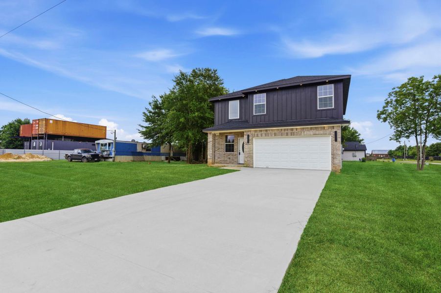 Front exterior of a new home in , Cleveland, TX, highlighting curb appeal (Image 2). Front exterior of a new home in , Cleveland, TX, highlighting curb appeal (Image 2).