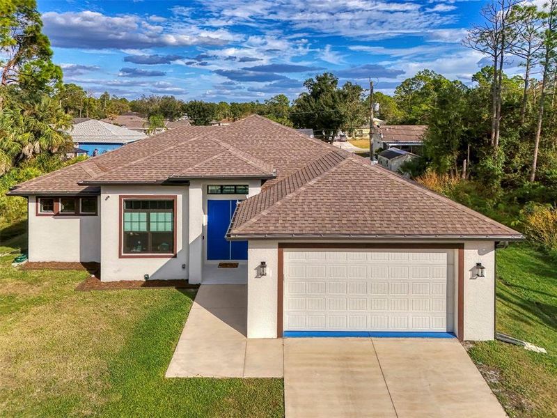 Front exterior of a new home in , North Port, FL, highlighting curb appeal (Image 24).