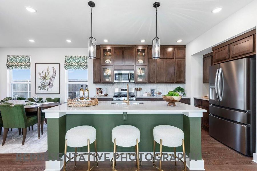 Representative Photo - A sunlit kitchen gleams with beautifully crafted cabinetry, a stunning central island, and bright, welcoming lights that make the whole space feel warm and elegant. Representative Photo - A sunlit kitchen gleams with beautifully crafted cabinetry, a stunning central island, and bright, welcoming lights that make the whole space feel warm and elegant.