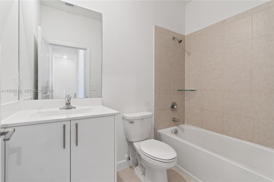 Furnished interior view inside a new home in Harmony Parc, Homestead (Image 9).