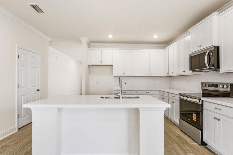 Furnished interior view inside a new home in Natureview, Freeport (Image 11).