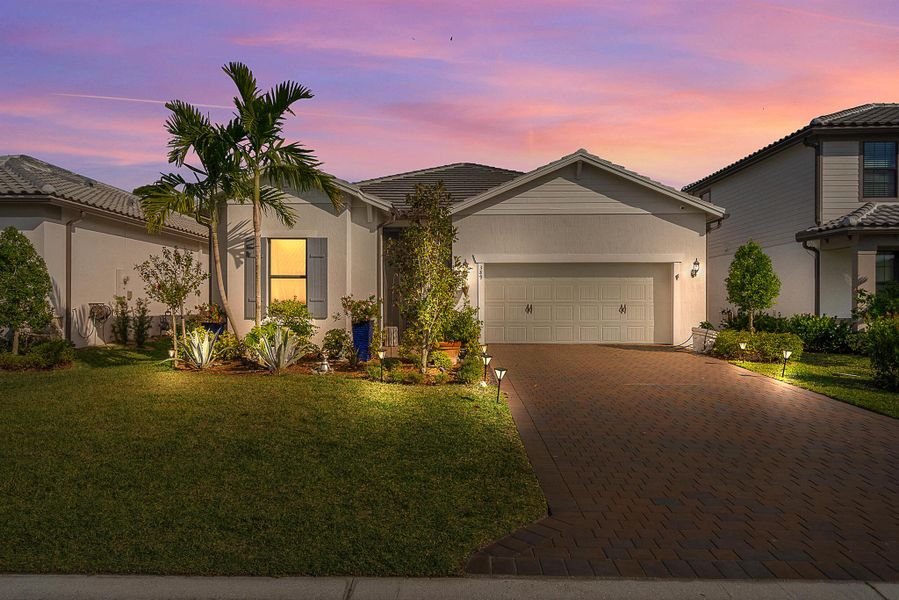 Front exterior of a new home in Veranda Gardens, Port St. Lucie, FL, highlighting curb appeal (Image 2). Front exterior of a new home in Veranda Gardens, Port St. Lucie, FL, highlighting curb appeal (Image 2).