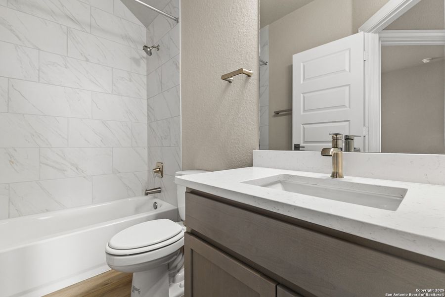 Furnished interior view inside a new home in The Enclave at Potranco Oaks, Castroville (Image 13).