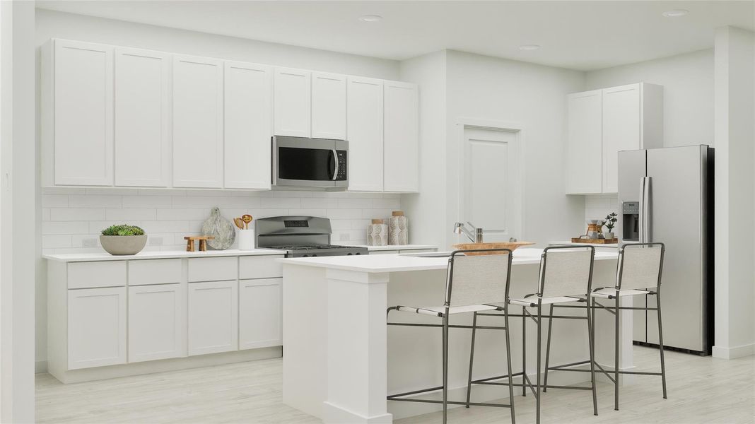 Kitchen featuring decorative backsplash, stainless steel appliances, a breakfast bar, white cabinetry, and a center island with sink Kitchen featuring decorative backsplash, stainless steel appliances, a breakfast bar, white cabinetry, and a center island with sink