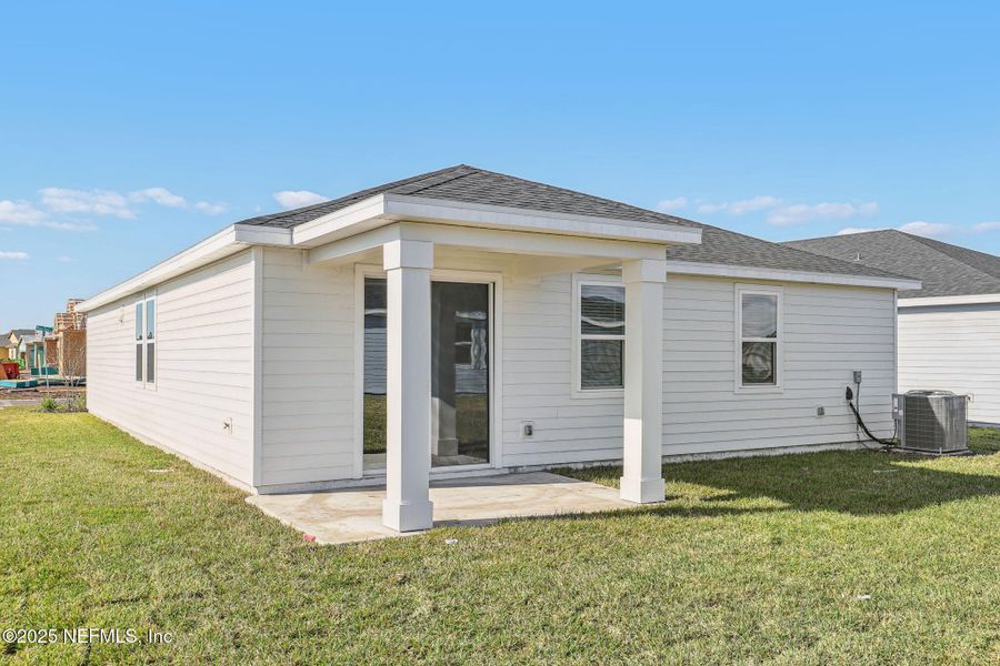 Front exterior of a new home in Lakes at Bella Lago - Signature Series, Green Cove Springs, FL, highlighting curb appeal (Image 21). Front exterior of a new home in Lakes at Bella Lago - Signature Series, Green Cove Springs, FL, highlighting curb appeal (Image 21).