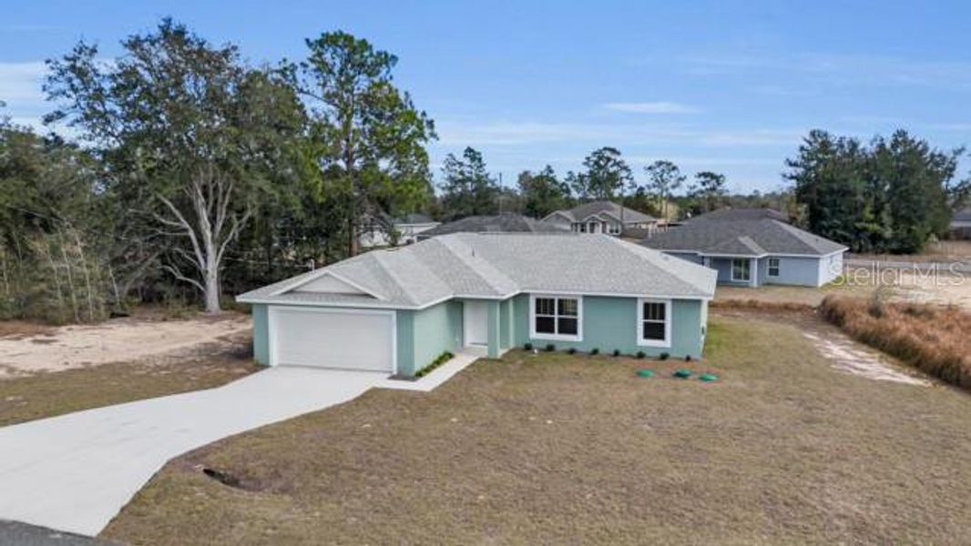Front exterior of a new home in , Ocala, FL, highlighting curb appeal (Image 17).