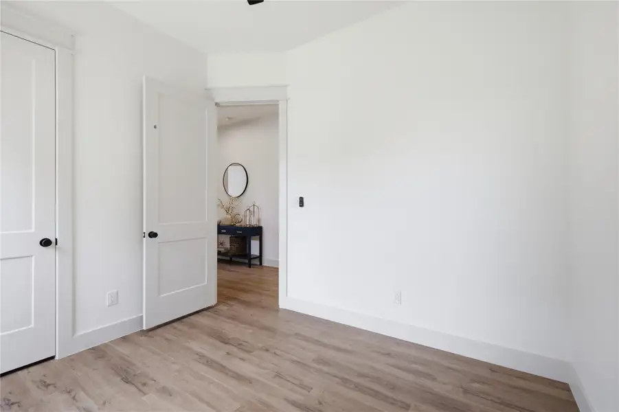 Streamlined doors and light wood flooring define this versatile room, offering clean lines and contemporary appeal. Streamlined doors and light wood flooring define this versatile room, offering clean lines and contemporary appeal.