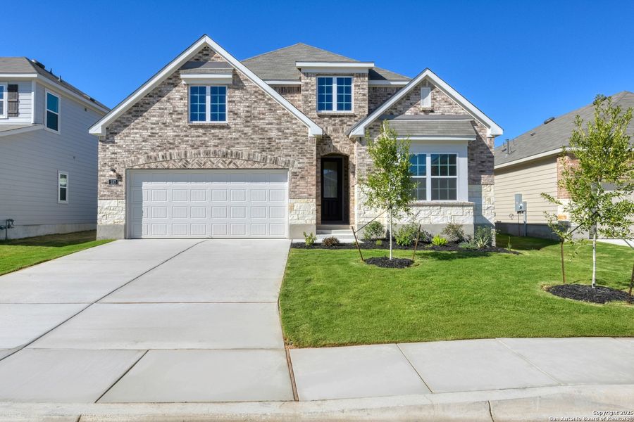 Front exterior of a new home in Cordova Trails, Seguin, TX, highlighting curb appeal (Image 1).
