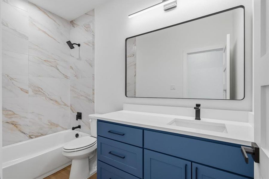 Custom tub shower with tile running to the ceiling!