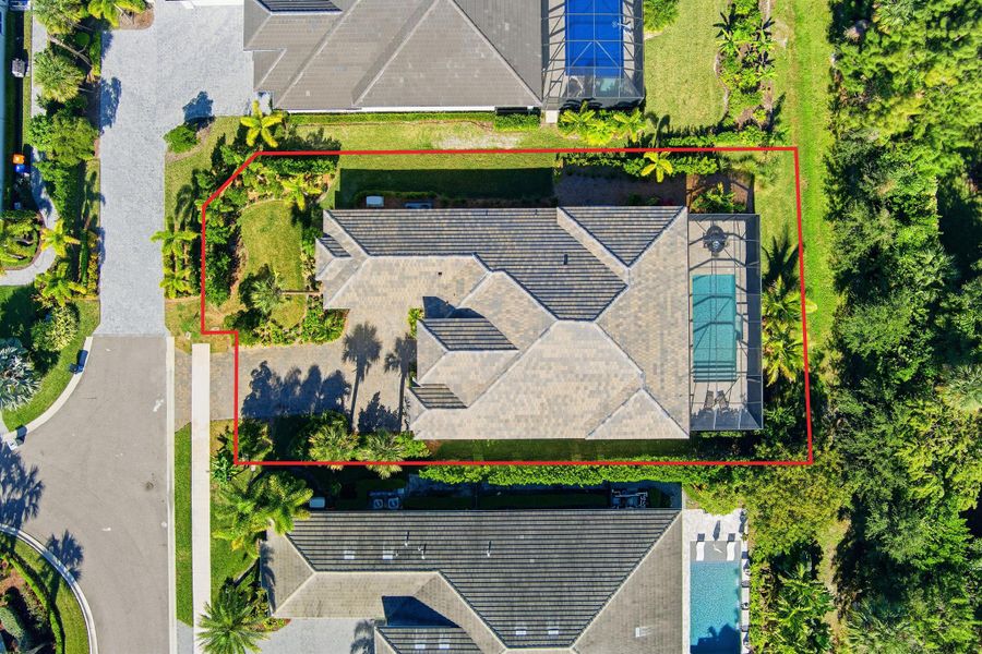 Front exterior of a new home in The Strand, Vero Beach, FL, highlighting curb appeal (Image 24).