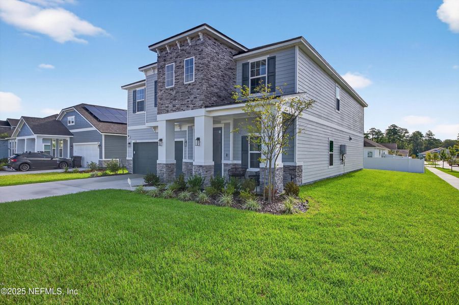 Front exterior of a new home in , Middleburg, FL, highlighting curb appeal (Image 26).