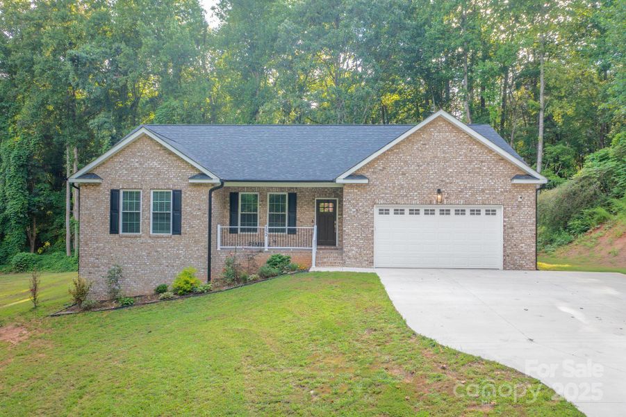 Front exterior of a new home in , Statesville, NC, highlighting curb appeal (Image 1).