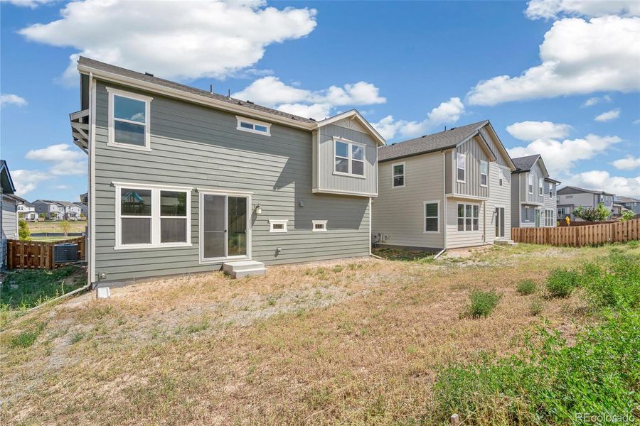 Exterior details and patio area of a home in Turnberry, Commerce City (Image 4).