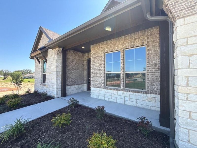 Exterior details and patio area of a home in Oak Grove Addition, Springtown (Image 4).