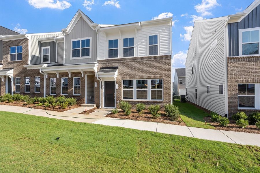 Front exterior of a new home in Renaissance at White Oak, Garner, NC, highlighting curb appeal (Image 2). Front exterior of a new home in Renaissance at White Oak, Garner, NC, highlighting curb appeal (Image 2).