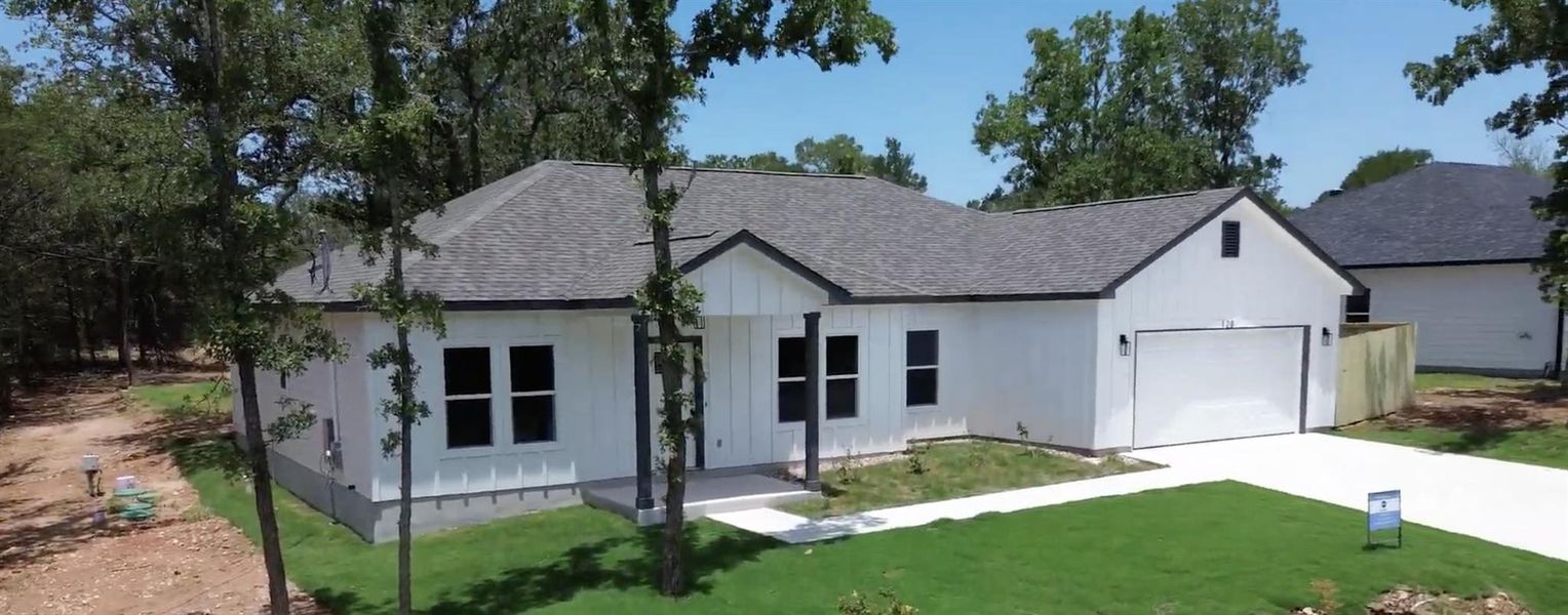 Front exterior of a new home in , Bastrop, TX, highlighting curb appeal (Image 22). Front exterior of a new home in , Bastrop, TX, highlighting curb appeal (Image 22).