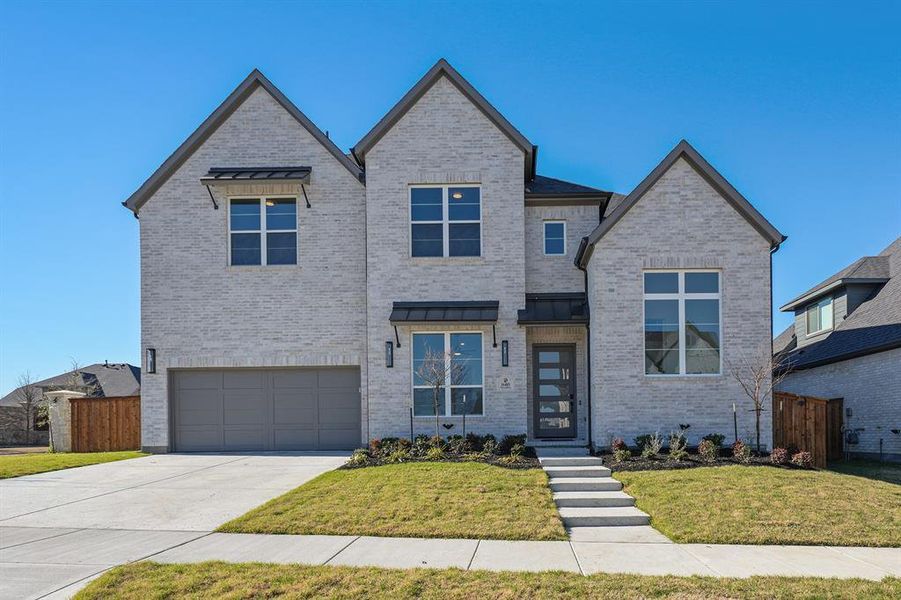 Front exterior of a new home in Estates at Rockhill, Frisco, TX, highlighting curb appeal (Image 27). Front exterior of a new home in Estates at Rockhill, Frisco, TX, highlighting curb appeal (Image 27).
