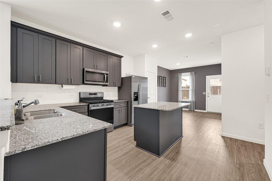 Spacious kitchen and open breakfast nook area with plenty of natural light.