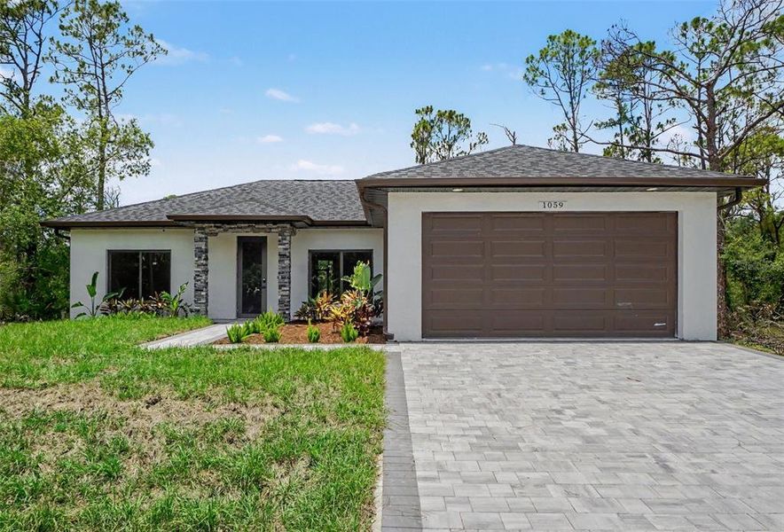 Front exterior of a new home in , Port Charlotte, FL, highlighting curb appeal (Image 24). Front exterior of a new home in , Port Charlotte, FL, highlighting curb appeal (Image 24).