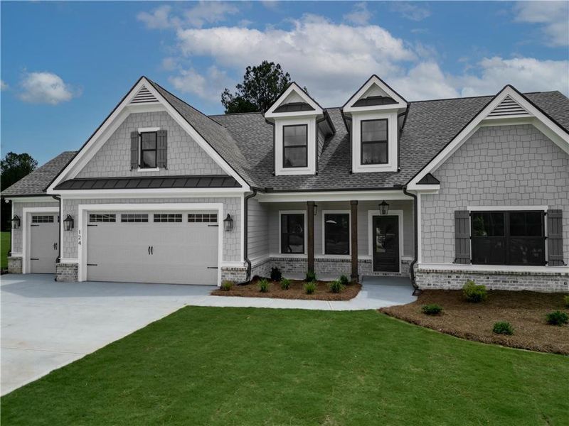 Front exterior of a new home in Riverwalk, Monroe, GA, highlighting curb appeal (Image 2). Front exterior of a new home in Riverwalk, Monroe, GA, highlighting curb appeal (Image 2).