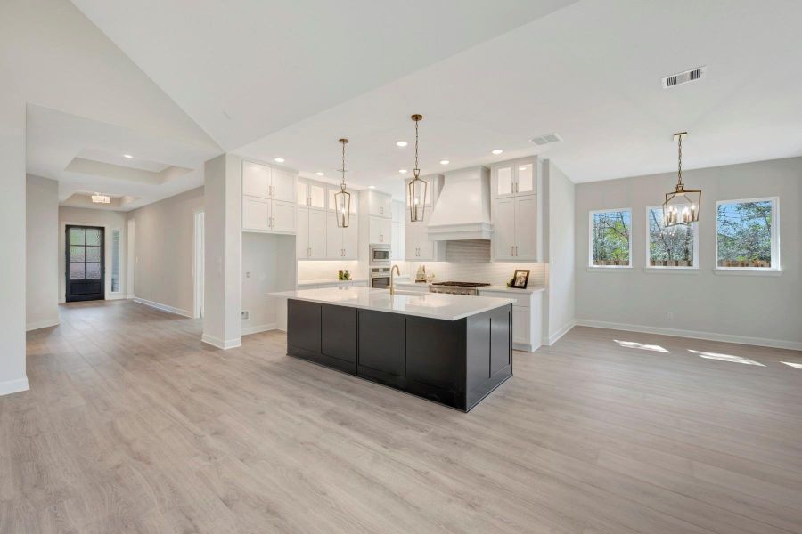 EXAMPLE PHOTO: Gorgeous Kitchen with huge island/breakfast bar, cabinets that soar to the ceiling & an open design that appeals to all!