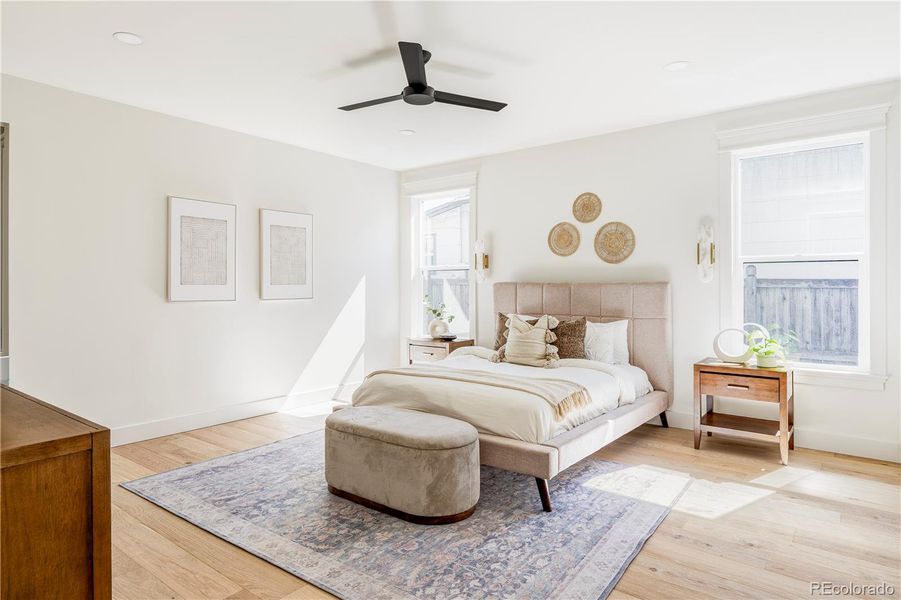 Main-level primary suite with spacious layout, walk-in closet, and natural light