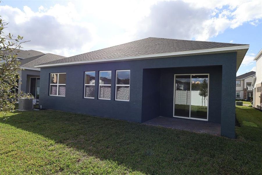 Exterior details and patio area of a home in Estates at Rivercrest, Sanford (Image 20).
