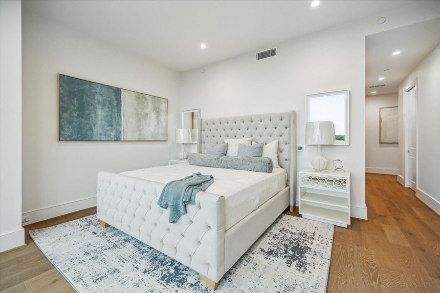Spacious primary bedroom. Photos are of a similar unit with the same floor plan Spacious primary bedroom. Photos are of a similar unit with the same floor plan