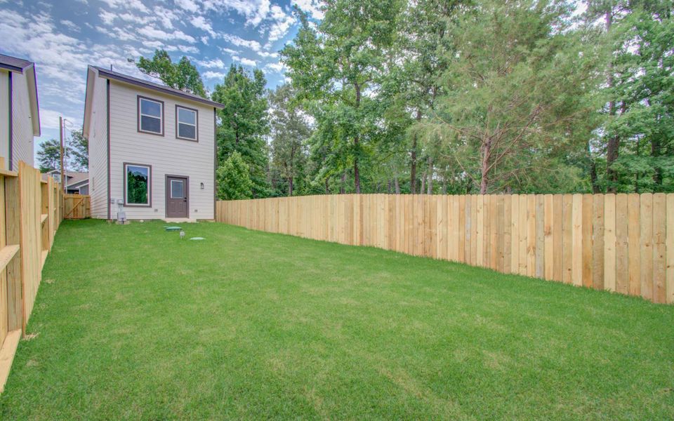 Exterior details and patio area of a home in Arrowhead Lakes, Willis (Image 29). Exterior details and patio area of a home in Arrowhead Lakes, Willis (Image 29).