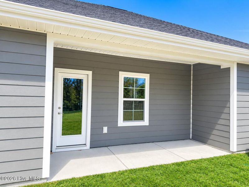 Exterior details and patio area of a home in East Lake, Leland (Image 16).