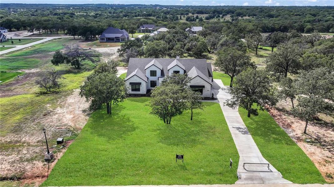 Front exterior of a new home in , Weatherford, TX, highlighting curb appeal (Image 23). Front exterior of a new home in , Weatherford, TX, highlighting curb appeal (Image 23).