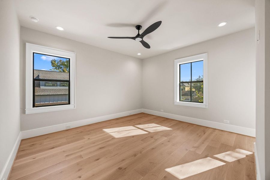 Secondary Bedrooms are spacious & offer wood floors, large windows, walk-in closets & en-suite bathroom.