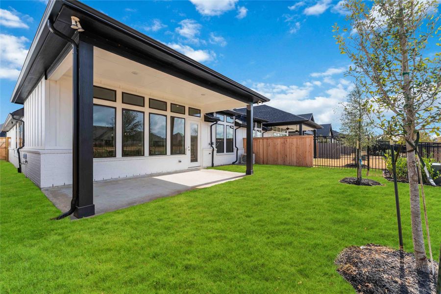 Exterior details and patio area of a home in Elyson, Katy (Image 4). Exterior details and patio area of a home in Elyson, Katy (Image 4).