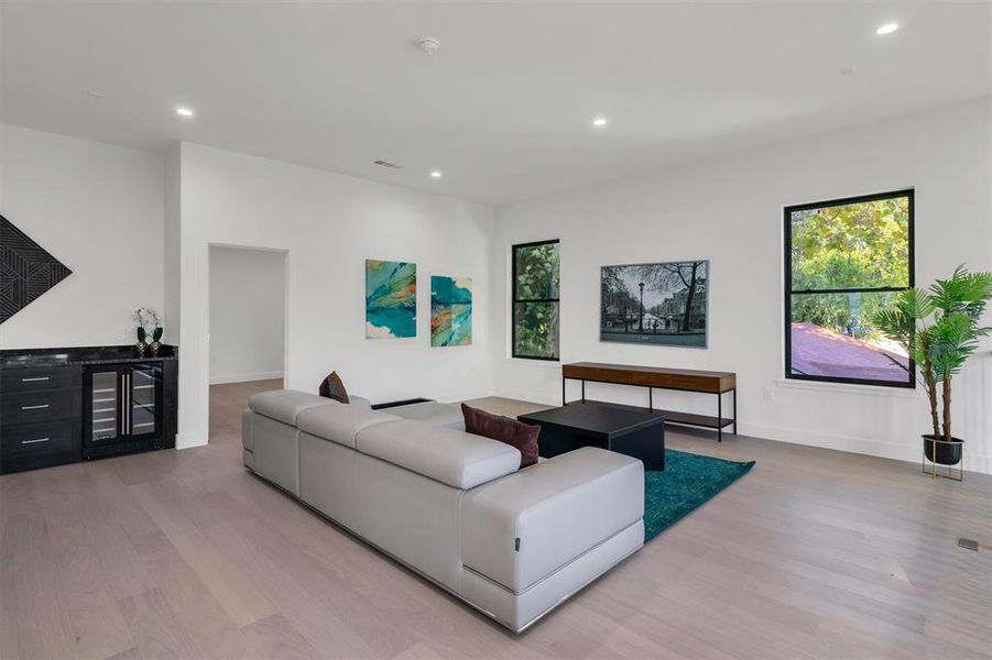 Living room with light hardwood / wood-style flooring