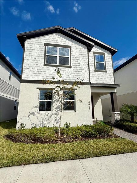 Front exterior of a new home in , St. Cloud, FL, highlighting curb appeal (Image 1). Front exterior of a new home in , St. Cloud, FL, highlighting curb appeal (Image 1).