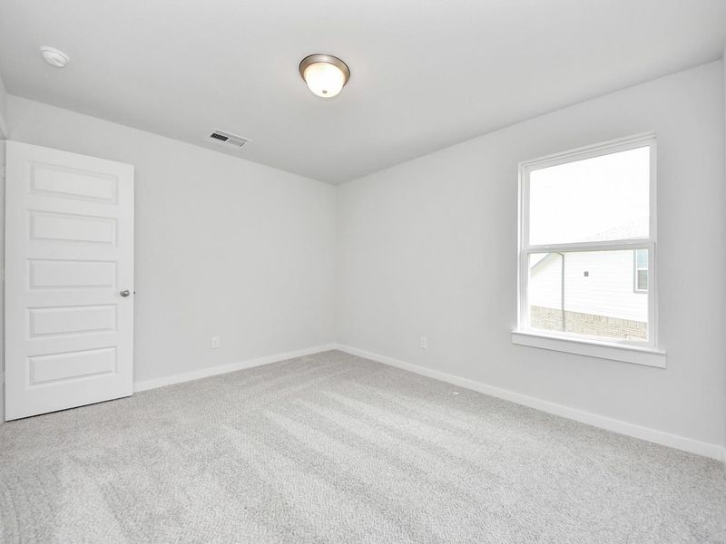 Spacious, unfurnished interior of a new home in Sunterra, Katy (Image 32).