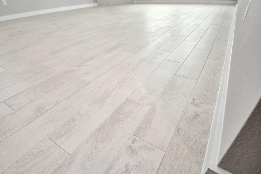 The premium tile flooring adds a touch of luxury to the space, creating the perfect setting for relaxing moments and cherished gatherings with loved ones.