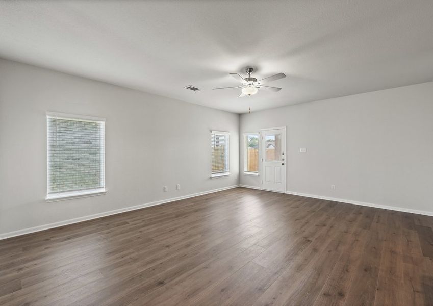 The living room has large windows that let in great, natural light. The living room has large windows that let in great, natural light.