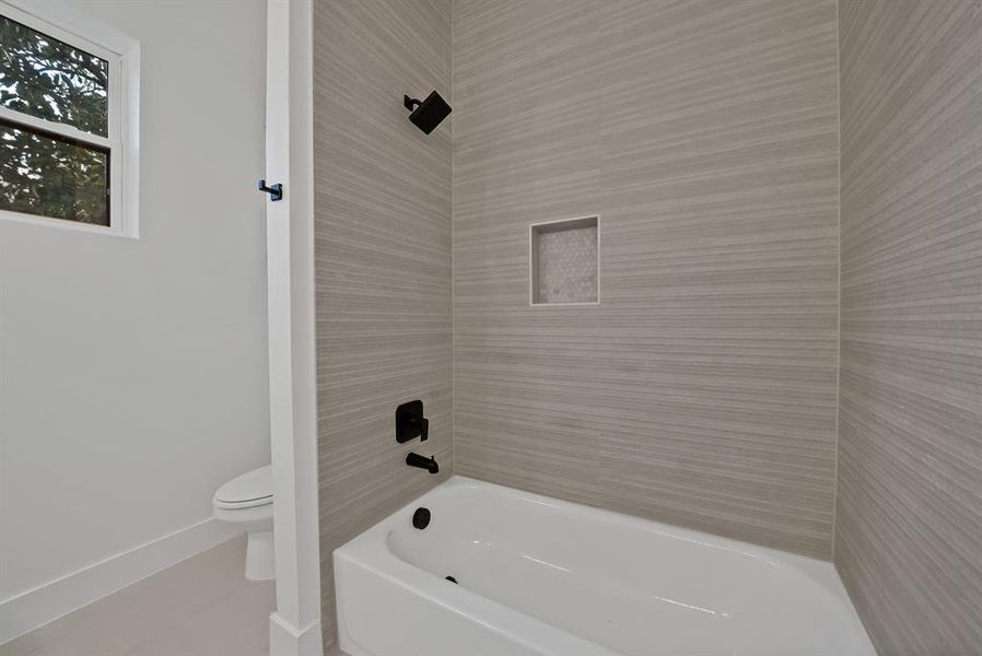 Bathroom with shower / bathtub combination and toilet Bathroom with shower / bathtub combination and toilet