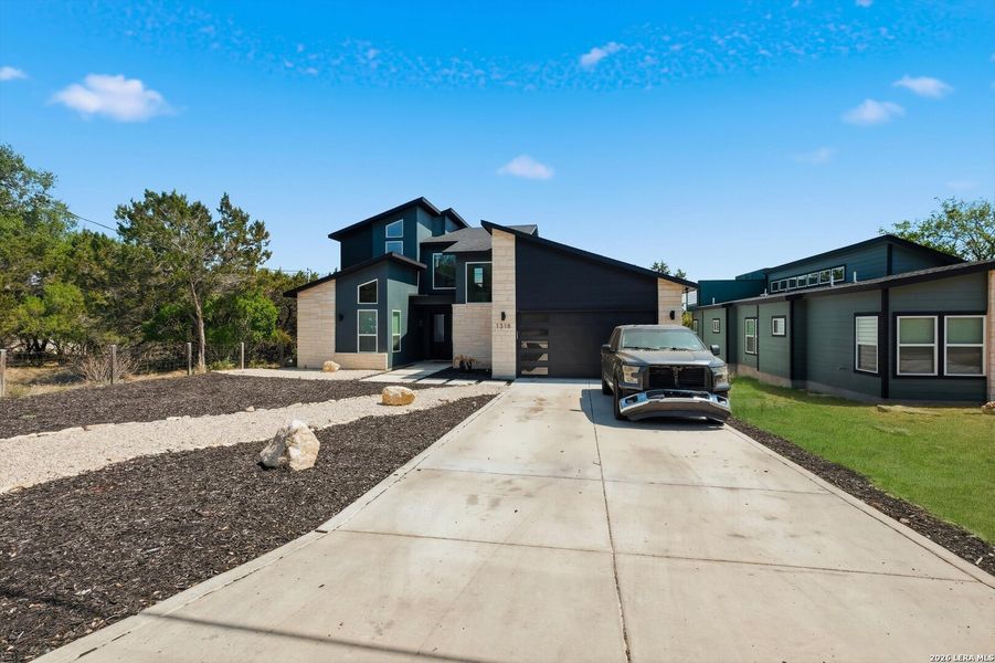 Front exterior of a new home in , Canyon Lake, TX, highlighting curb appeal (Image 23).